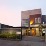 contemporary tropical house exterior in the sunset sky